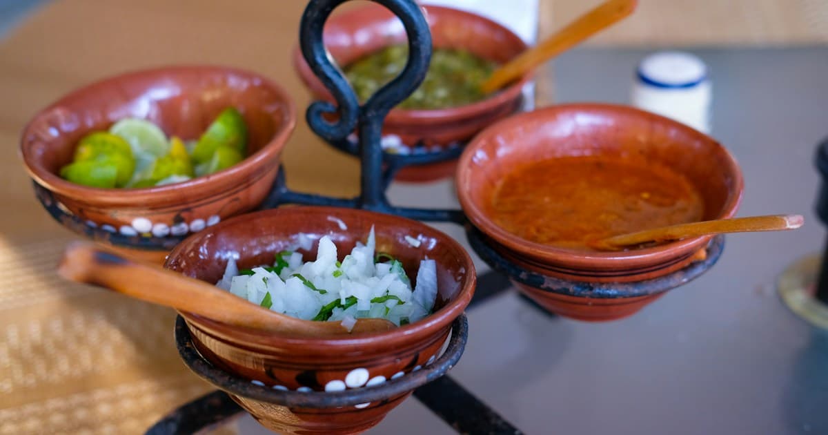 a table topped with three bowls of food