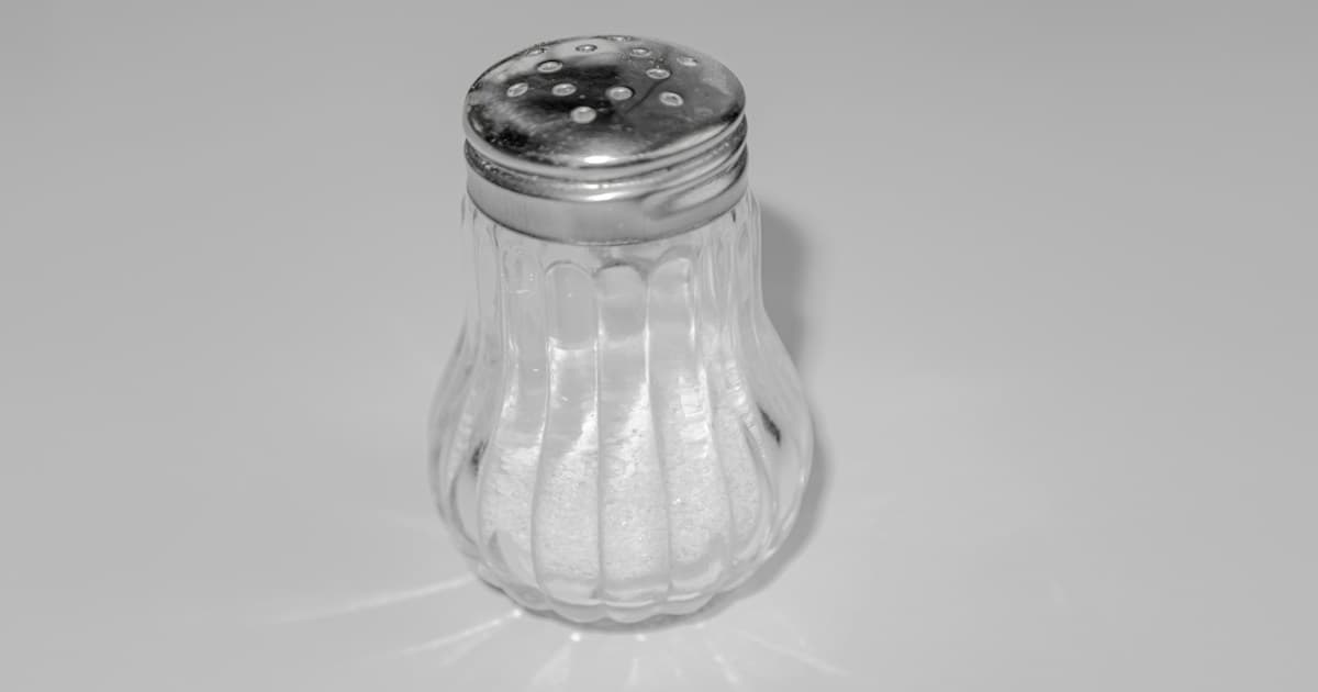a salt shaker sitting on top of a table